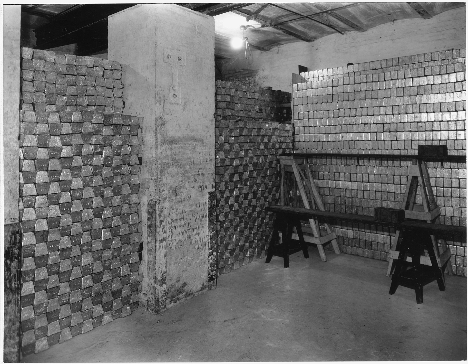 Rows of stacked gold bars filling a United States Mint vault in San Francisco around 1935.