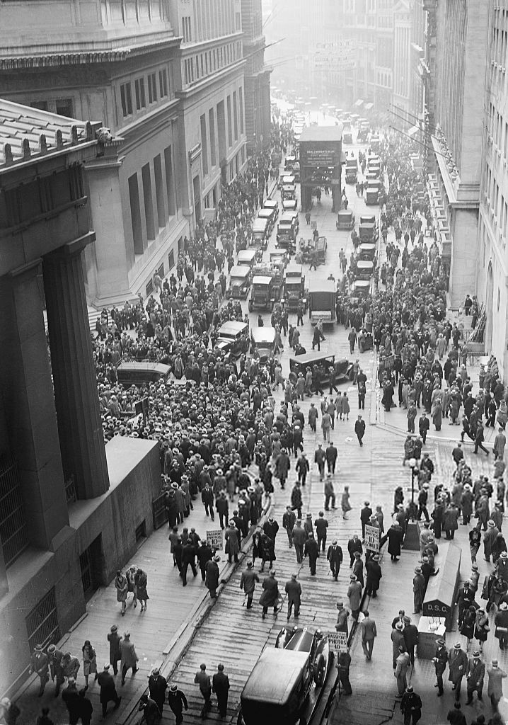 A solemn crowd gathered outside the New York Stock Exchange after the 1929 crash.